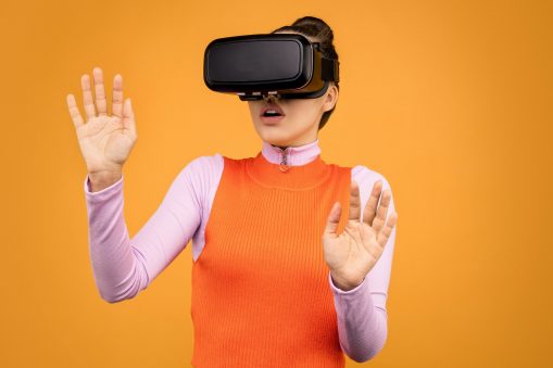 woman in long sleeve shirt wearing vr goggles 3761308